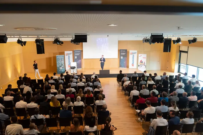 Packed auditorium during keynote presentation