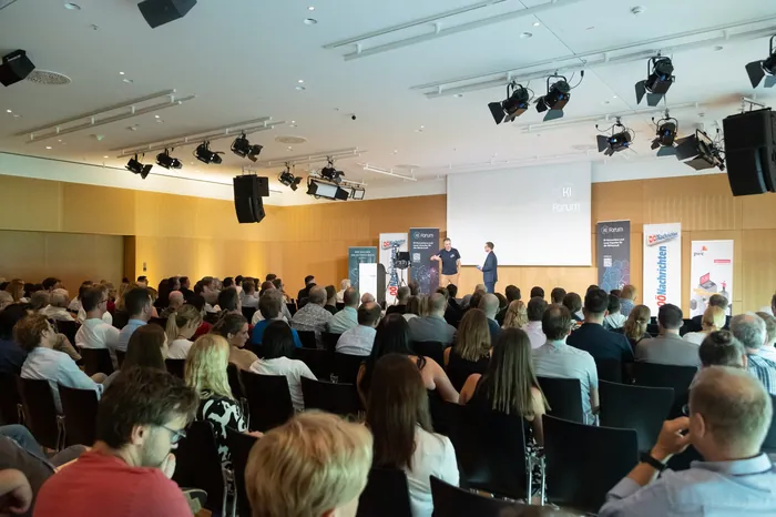 Main conference hall with full audience and speakers